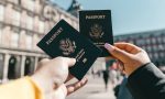 Best vacation spots in the United States - Tourists showing passports.